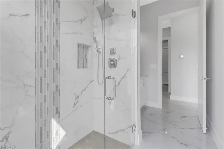 Bathroom with a shower with shower door