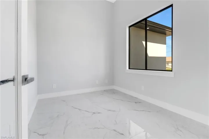 Unfurnished room featuring a healthy amount of sunlight