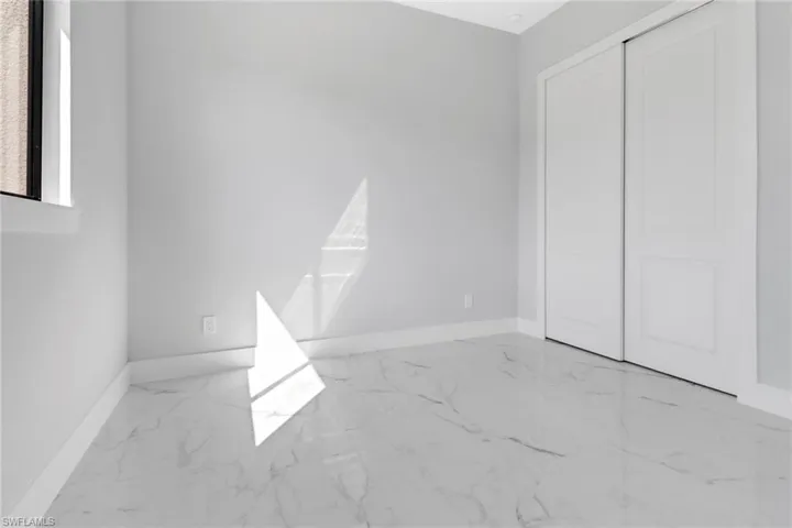 Unfurnished bedroom featuring a closet
