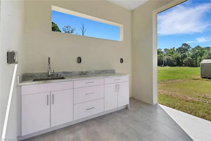 Bathroom featuring plenty of natural light and sink