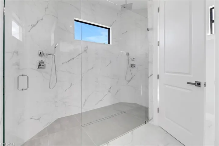 Bathroom featuring a shower with shower door