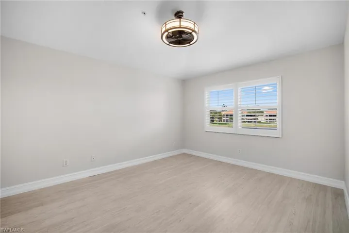 Empty room featuring light wood-style floors and baseboards