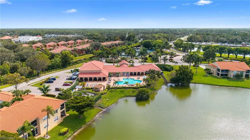 Aerial view of a pool and a large body of water