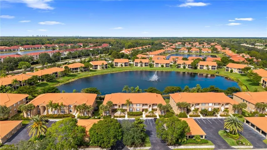 Aerial view of residential area featuring a large body of water