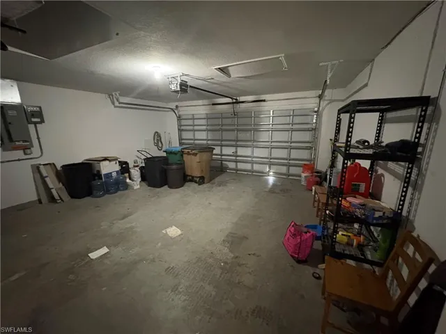 Garage featuring a garage door opener