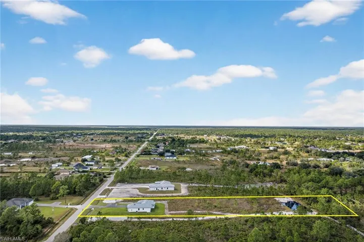 Aerial view of property's location featuring property parcel outlined