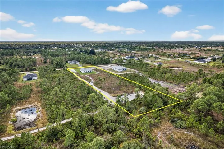 Aerial overview of property's location featuring property boundaries highlighted