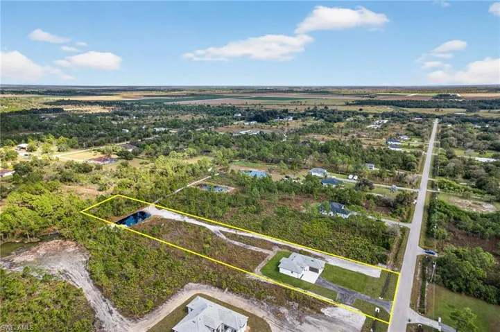 Aerial overview of property's location featuring property parcel outlined