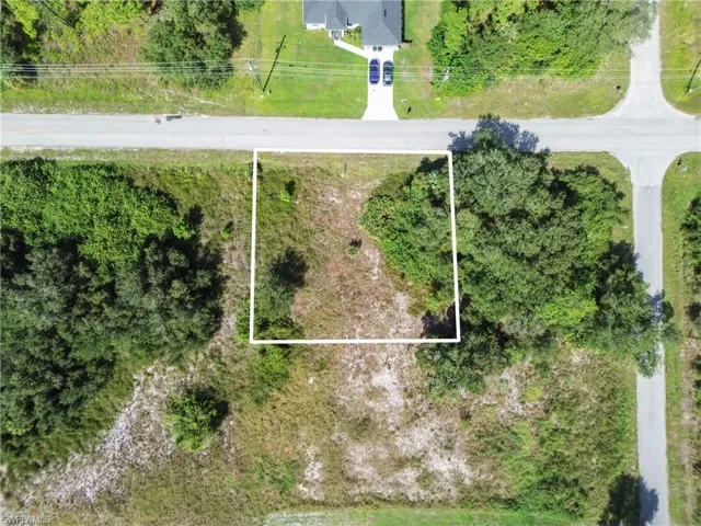 Aerial overview of property's location featuring property boundaries highlighted