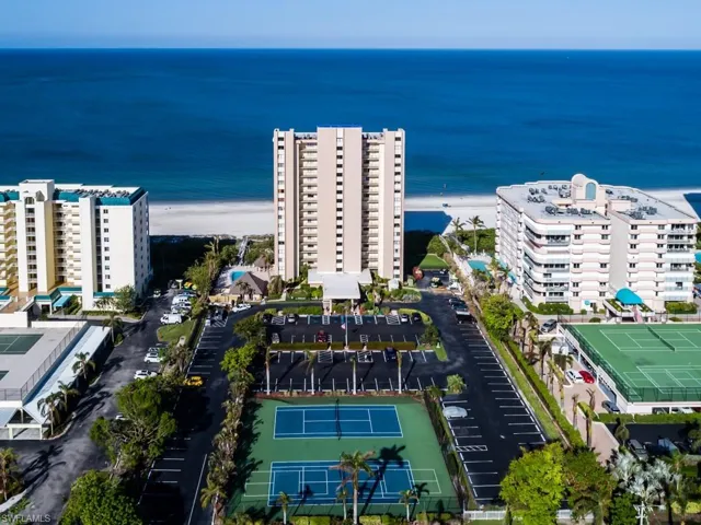 Aerial view of beautiful Beachfront Sea Winds with 4 pickleball courts or 2 tennis courts