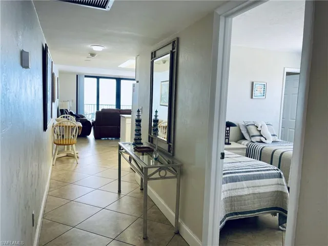 Hallway leading to living area-nice tile floors