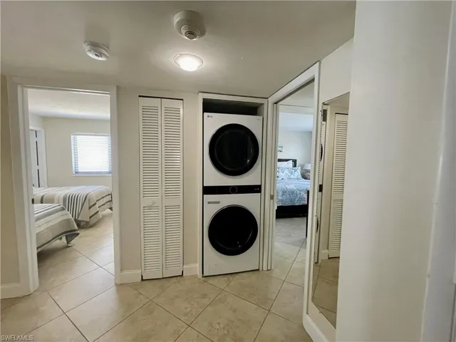 Large entry with NEW hallway stacked washer / drying machine