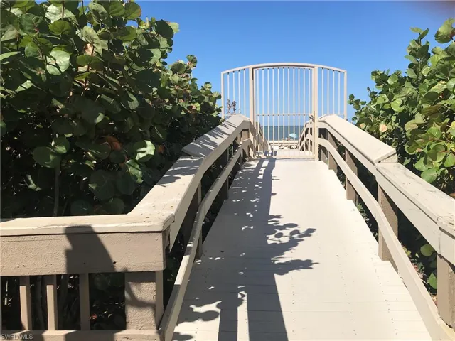 Private Boardwalk with security gate provides easy access to beach just steps away