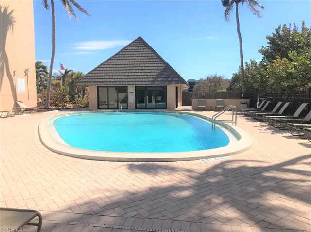 Sea Winds Community pool with a patio and enclosed  cabana