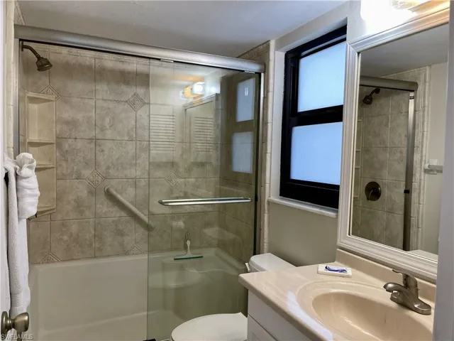 Bathroom with vanity and a stall shower