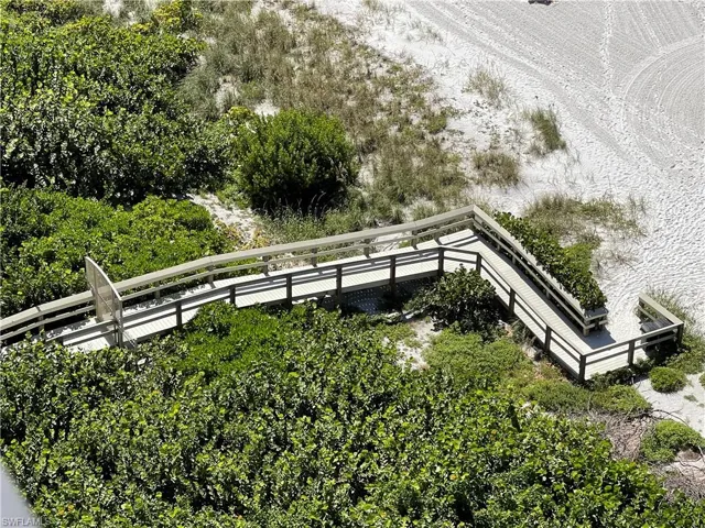 Beach boardwalk to beach with security gate