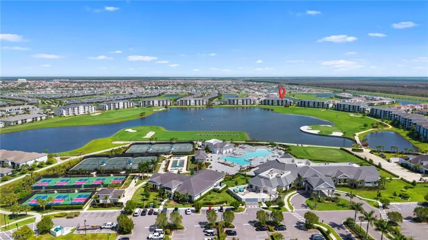 Drone / aerial view of a golf course and a large body of water