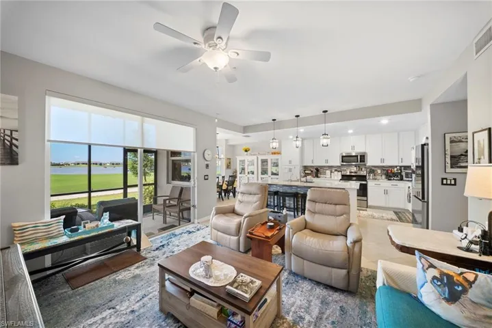 Living area with ceiling fan and recessed lighting
