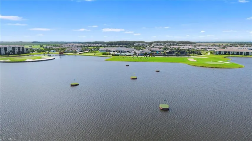 Water view with a golf course