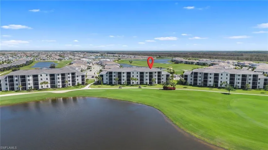 Drone / aerial view of a golf club and a large body of water