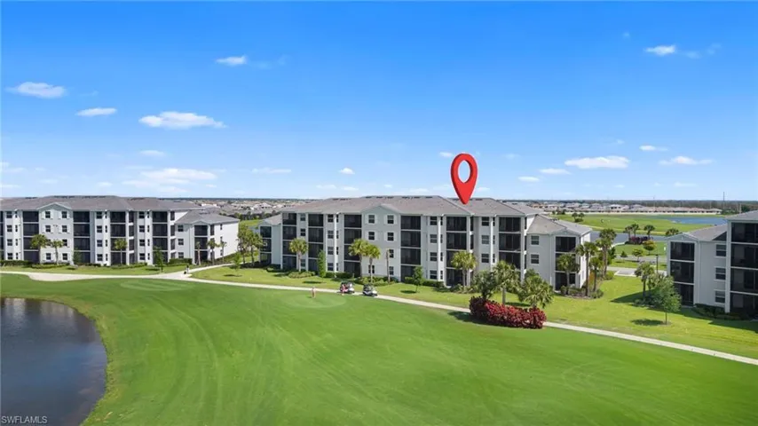 View of apartment building / complex featuring view of golf course