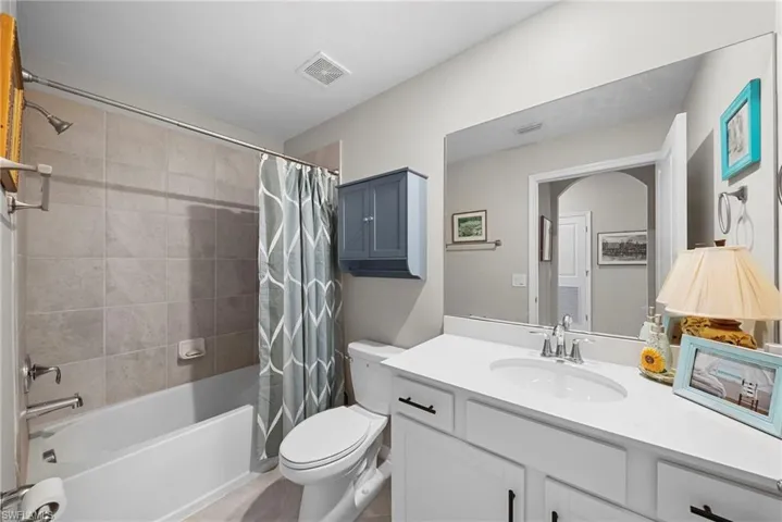 Full bath with vanity and shower / tub combo