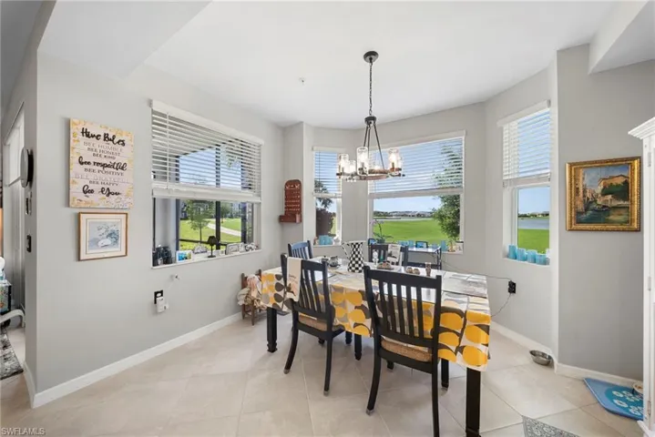 Dining space featuring a chandelier and light tile patterned floors