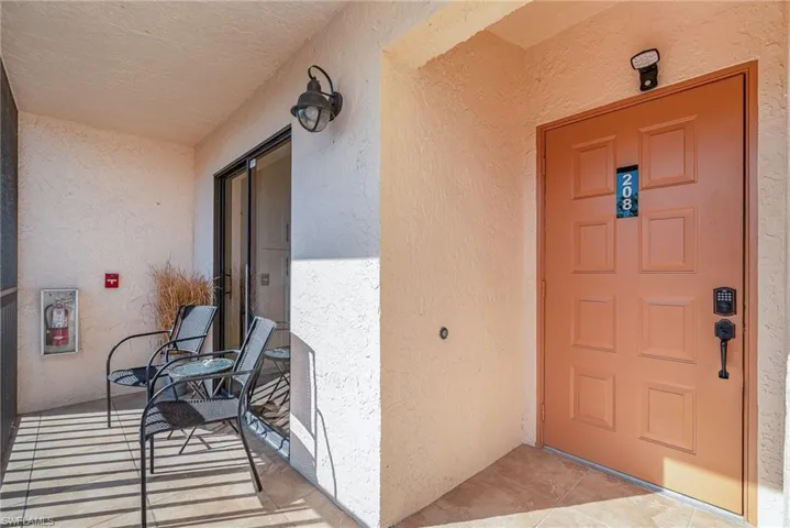 Doorway to property with stucco siding