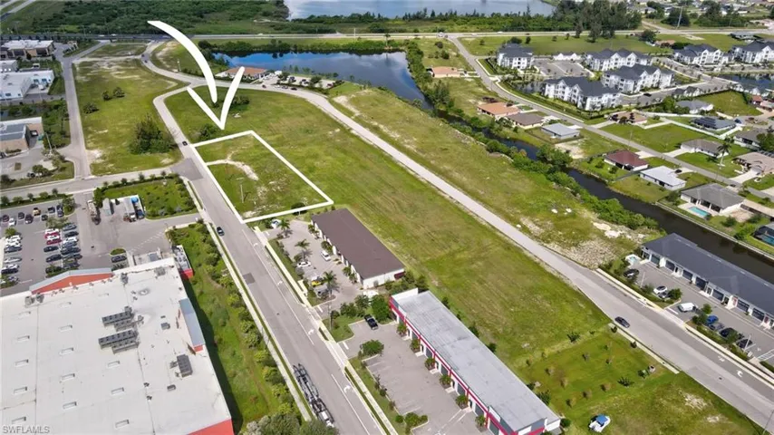 View of property location with a large body of water and property boundaries highlighted