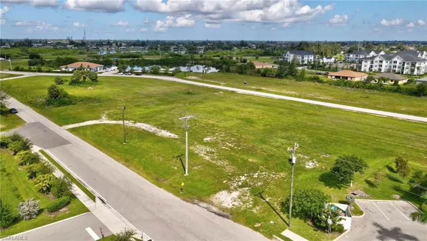 Aerial view of residential area featuring a large body of water