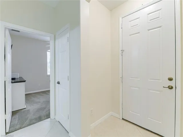 Hallway to guest bedroom and full bath