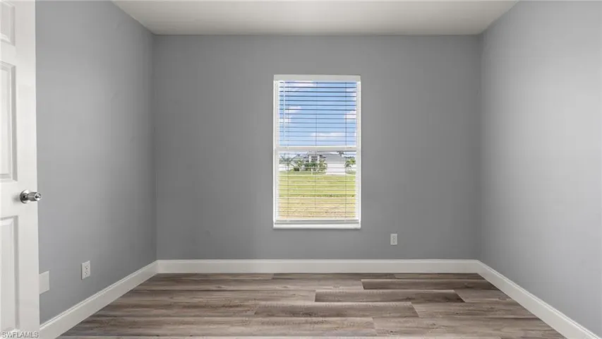 Spare room with hardwood / wood-style floors