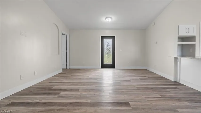 Spare room with light wood-type flooring