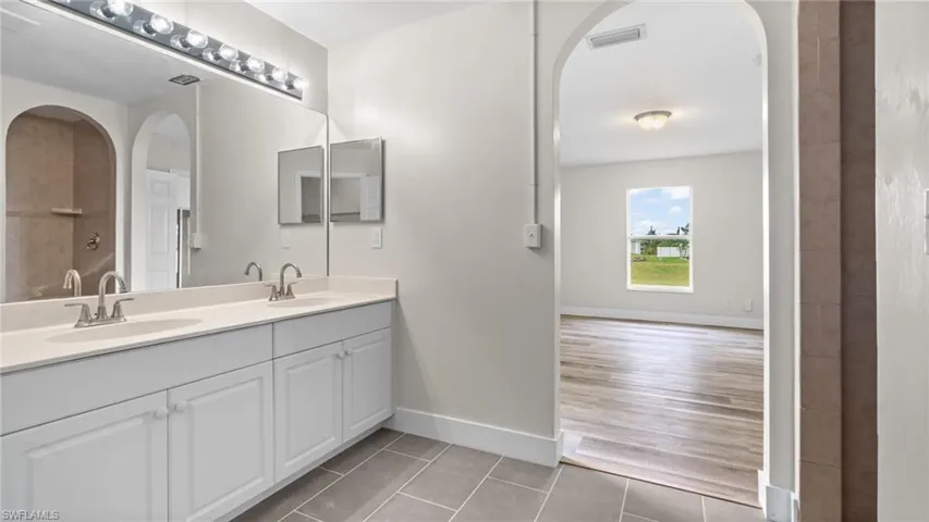 Bathroom with hardwood / wood-style floors and vanity