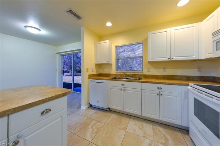 View from Kitchen towards Dining area and Back Yard