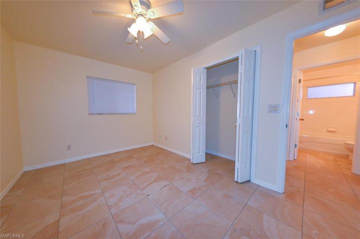 Guest bedroom with view towards bathroom & closet