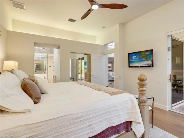 The Primary Bedroom has access to lanai for a late swim or spa