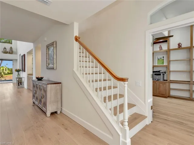 Through the front door there is an office on the right, kitchen in the left and stairs to 2nd floor