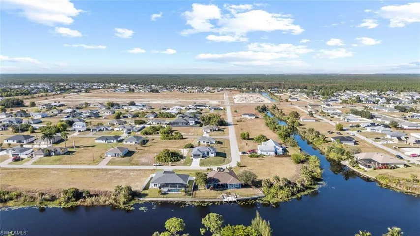 Aerial view of residential area with a large body of water