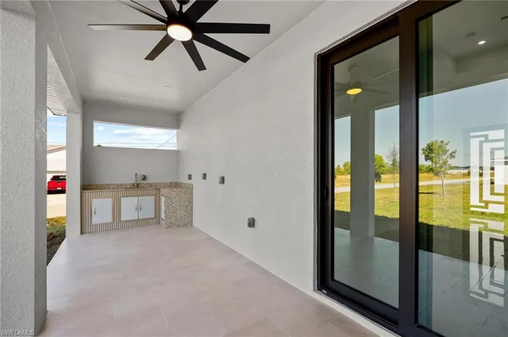 View of patio featuring a ceiling fan