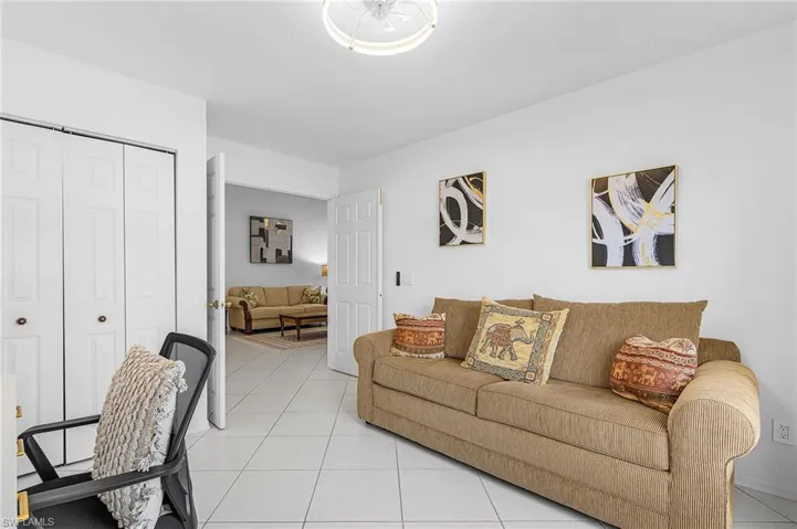 Living area with light tile patterned flooring