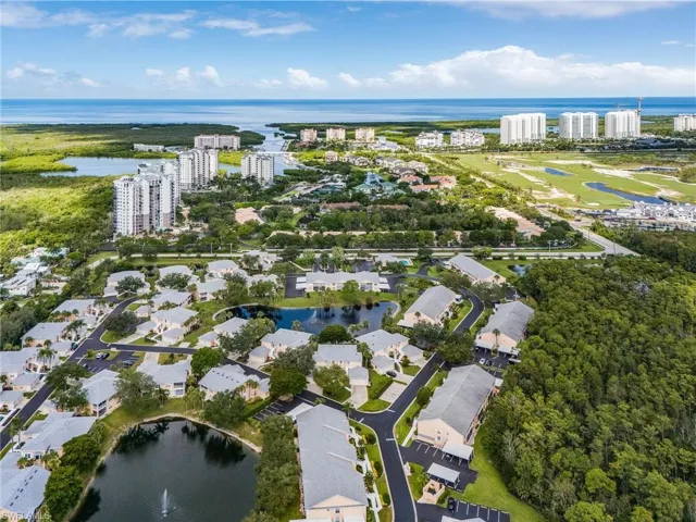View of property location with a nearby body of water and nearby urban area