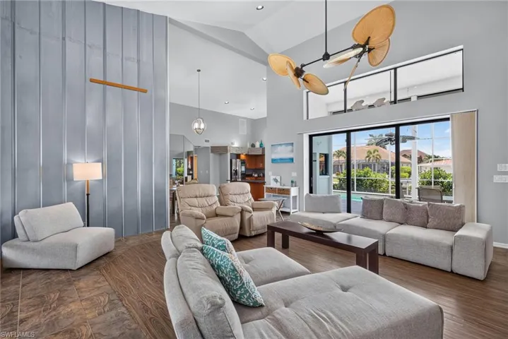 Large open living area with ultra high ceilings