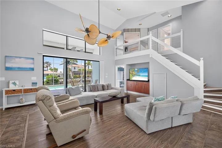 Large open living area with ultra high ceilings