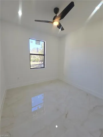 Full bathroom with vanity, a marble finish shower, and recessed lighting