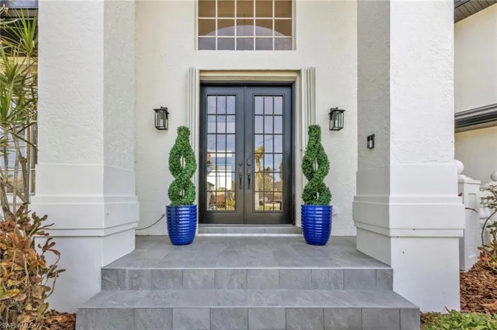 Doorway to property featuring french doors
