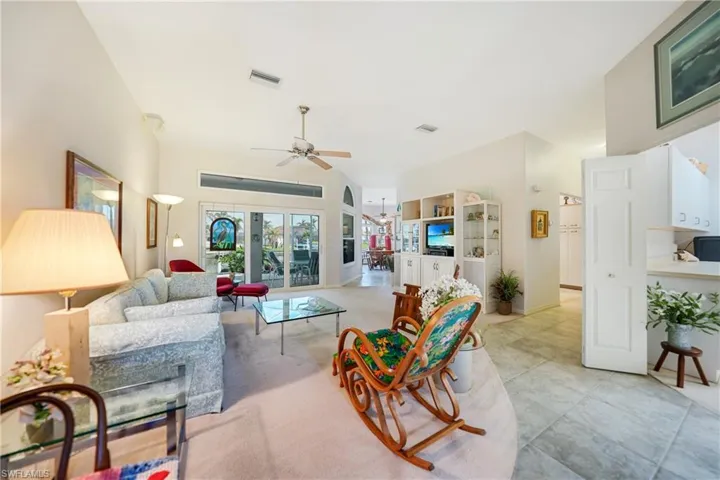 Living room featuring french doors and ceiling fan