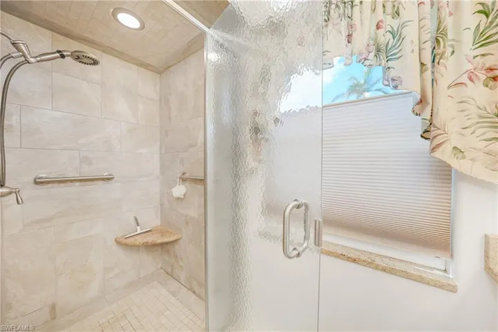 Bathroom with a shower with shower door