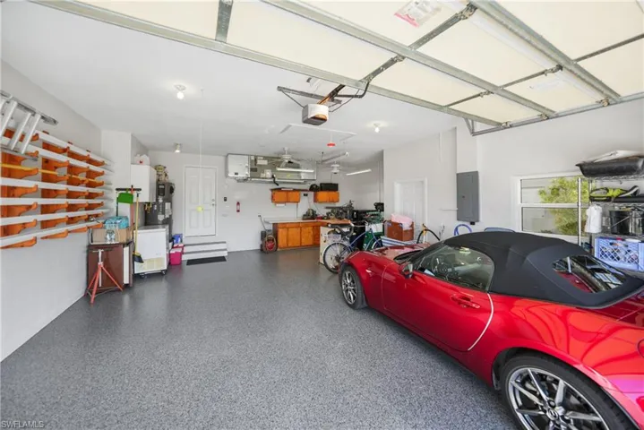 Garage with a garage door opener and electric panel