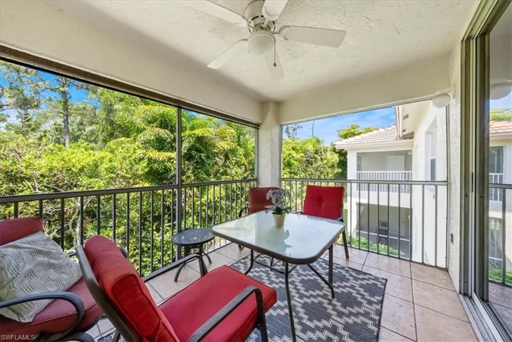 Sunroom featuring ceiling fan